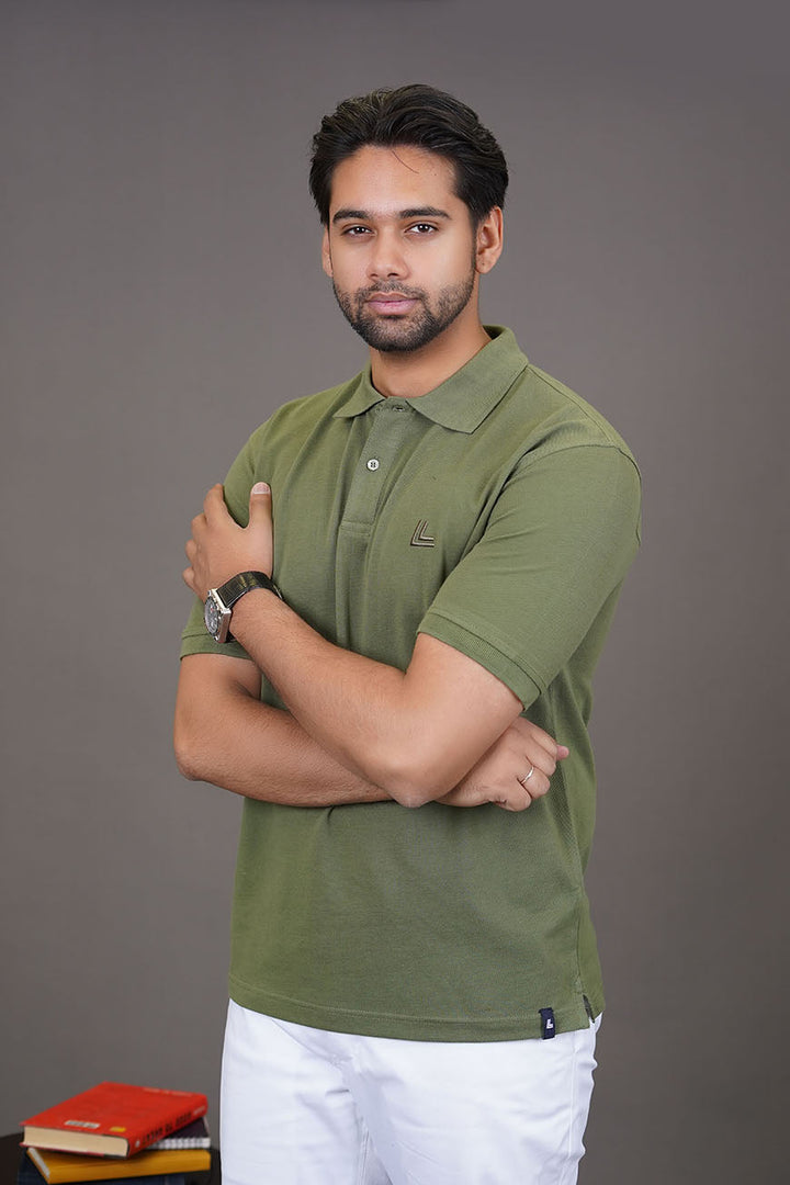 Mid-shot of olive polo shirt on model